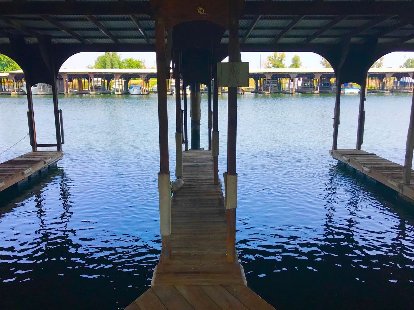 Walkway between the docks, boats moored either side